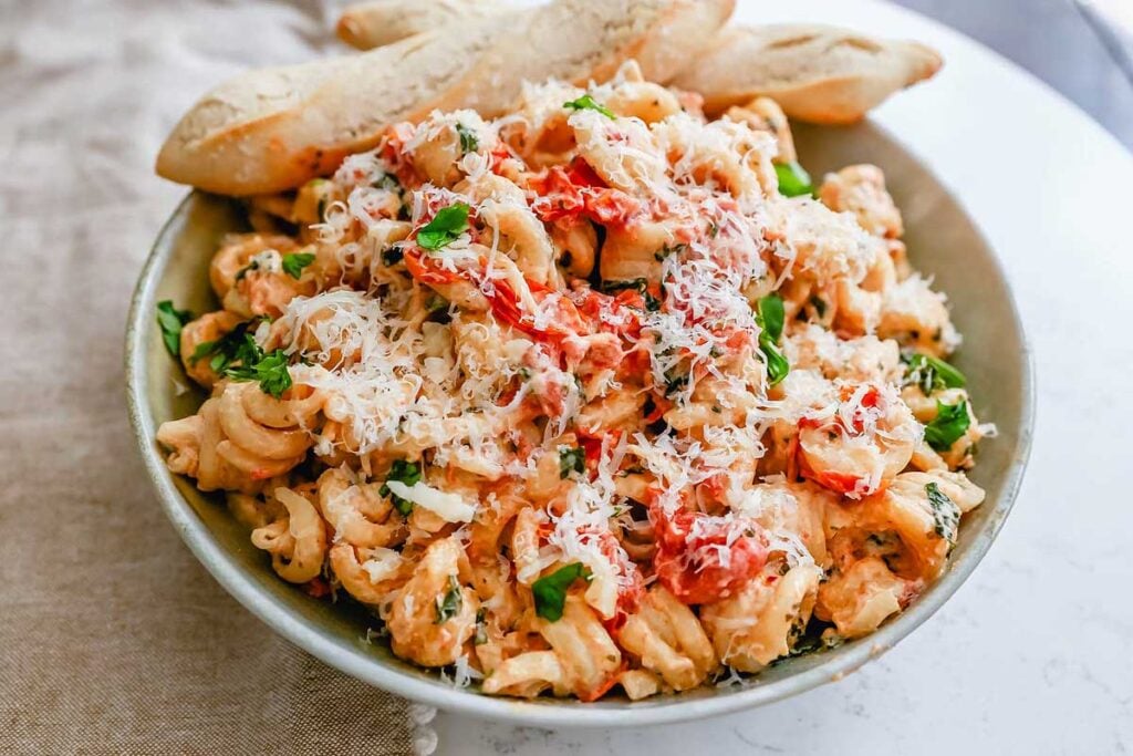 Bowl of baked pasta with boursin cheese