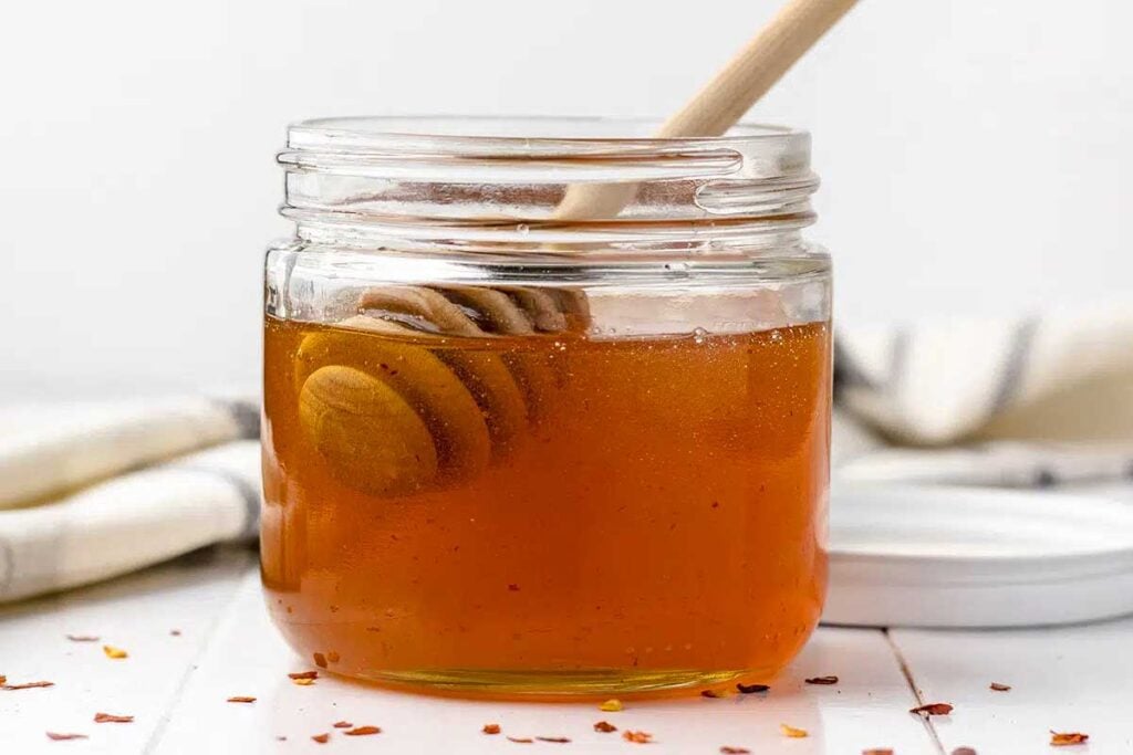 Hot honey in a glass jar.
