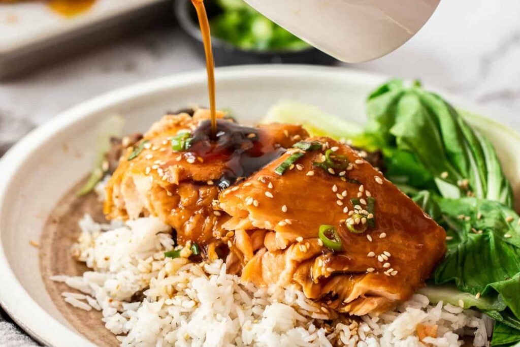Salmon on a plate with teriyaki poured on.