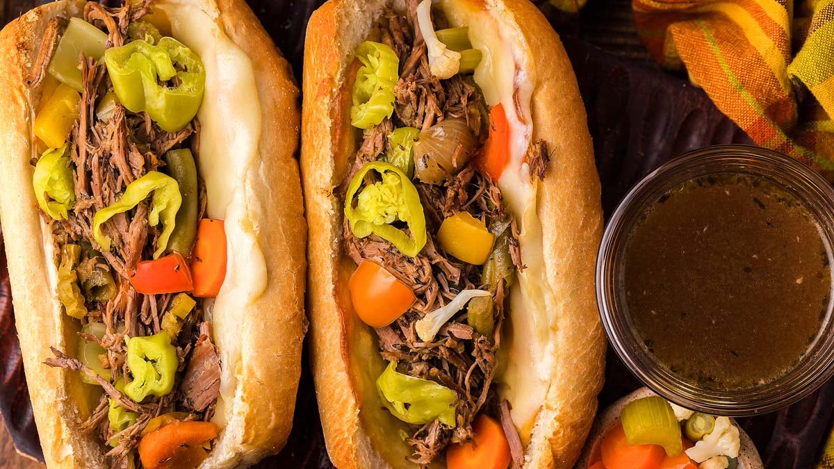 Two Italian beef buns on a tray.