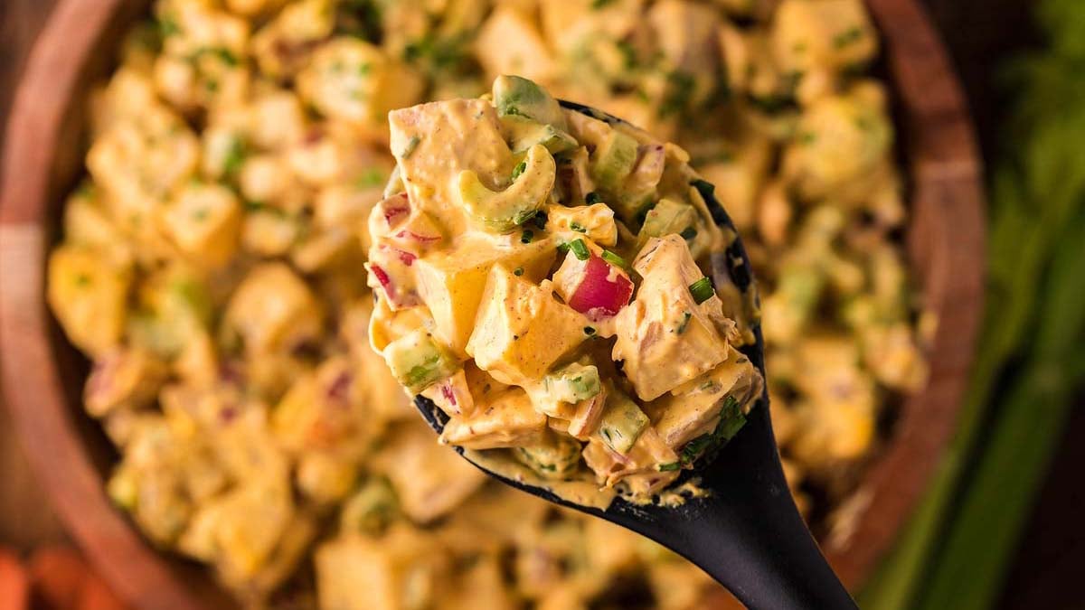 Smoked potato salad on a spoon.
