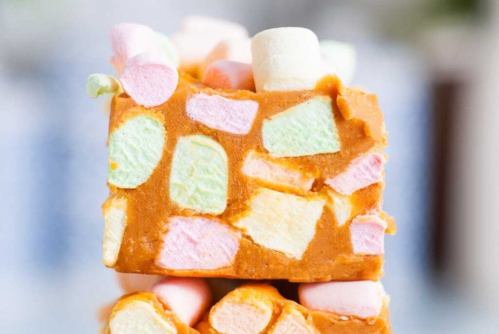 A cut peanut butter marshmallow confetti square.