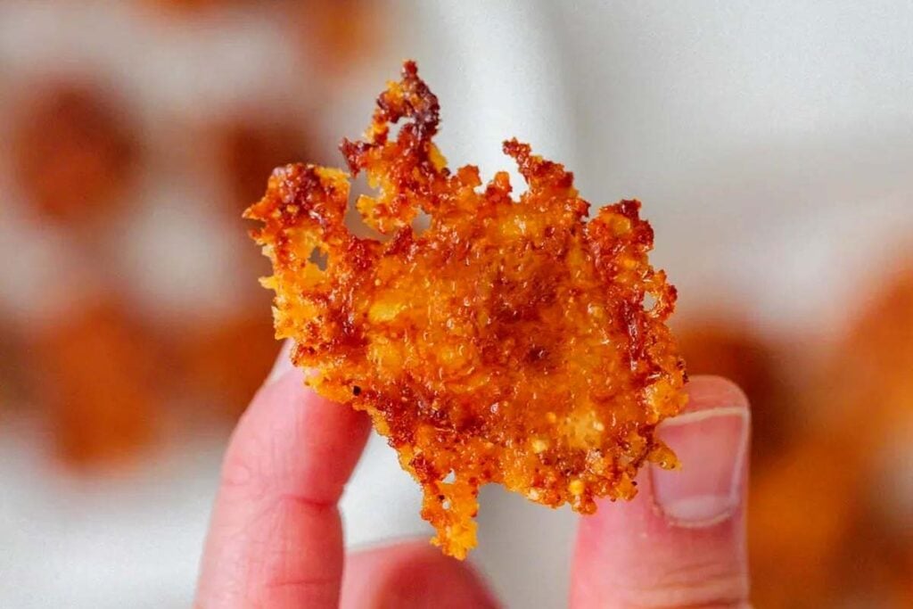 Holding a crispy potato.