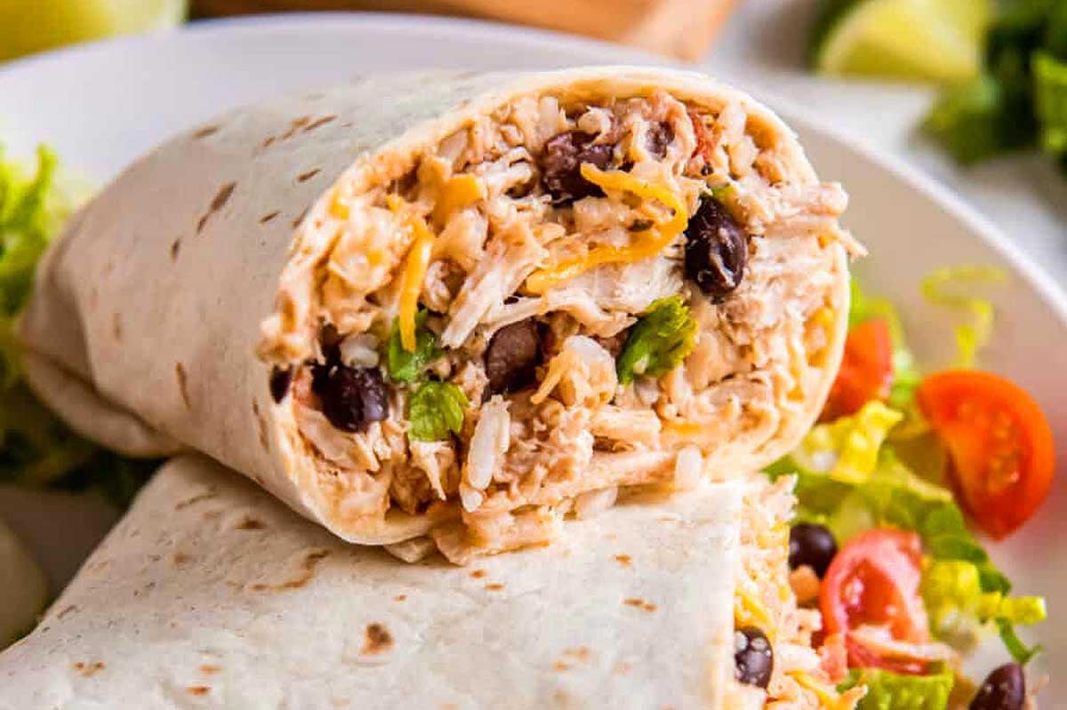 Chicken burritos on a plate.
