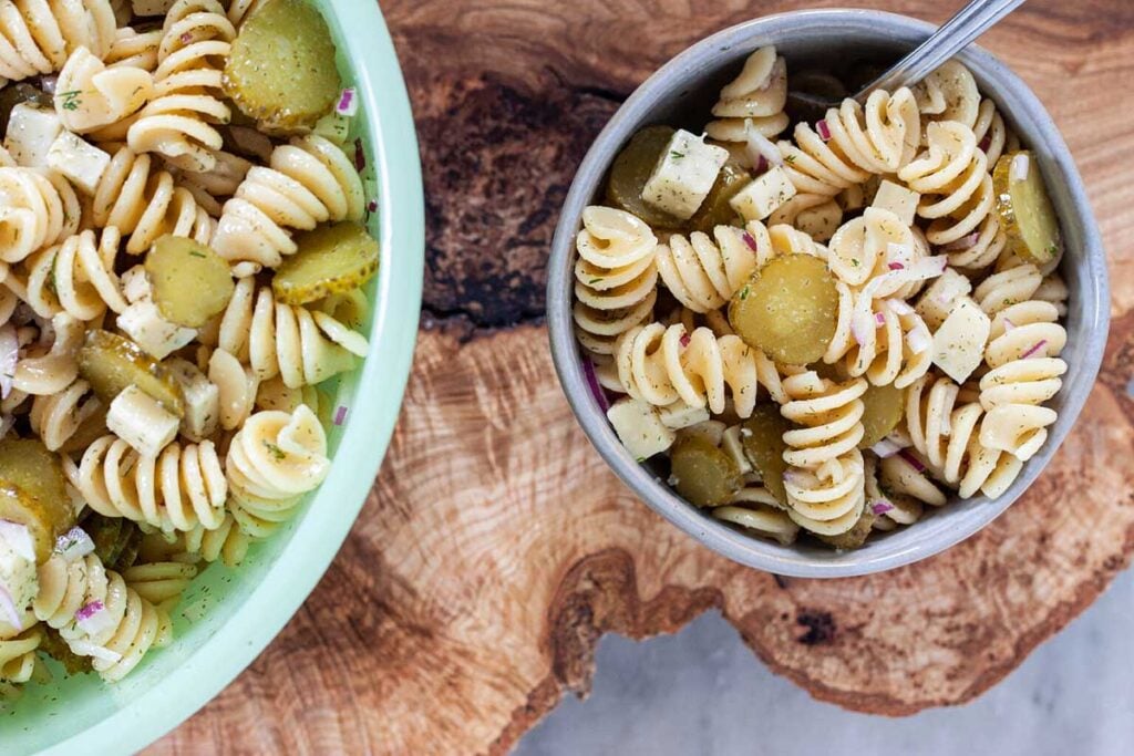 Bowl of dill pickle pasta salad with pickles