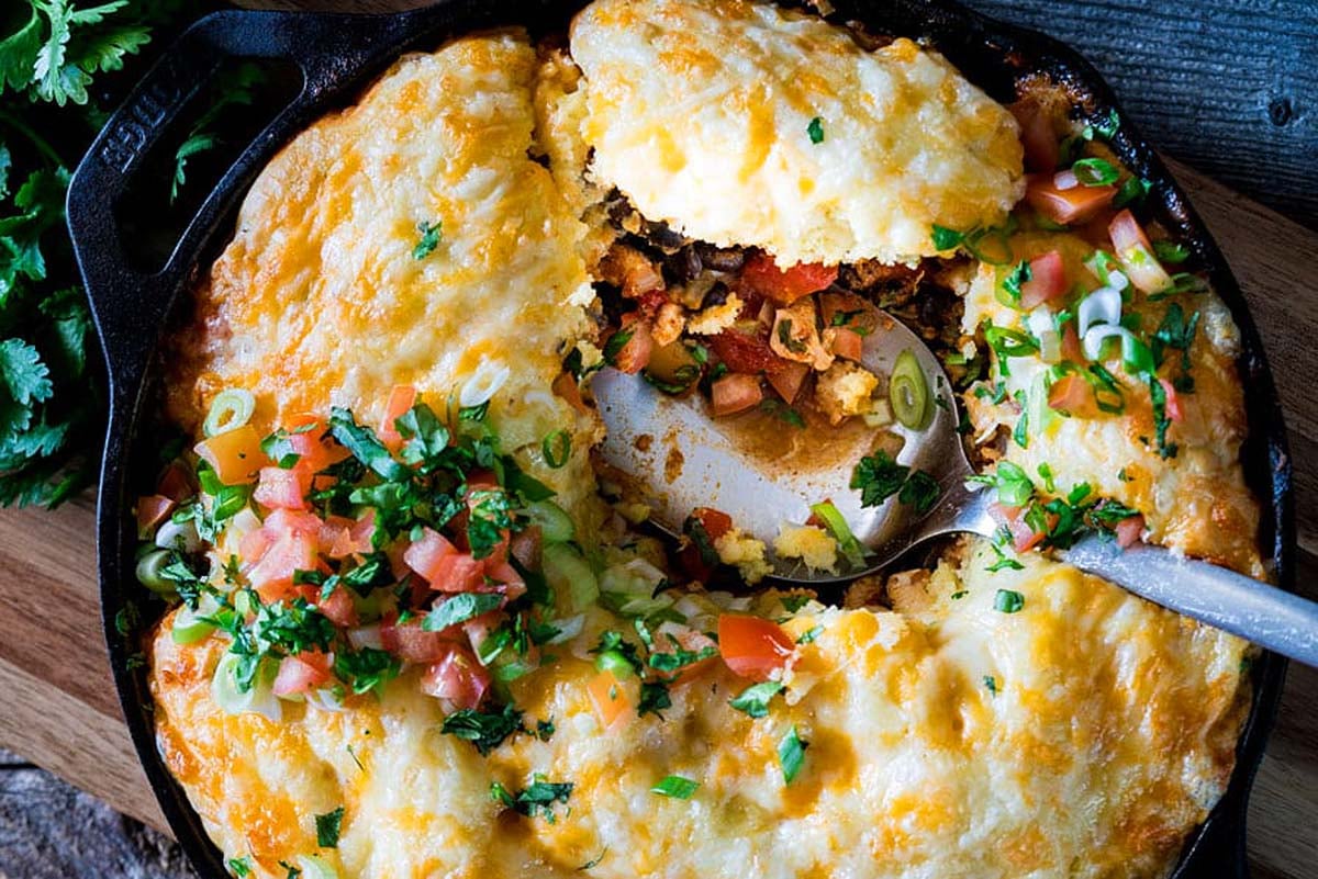 A skillet with a chicken dish.