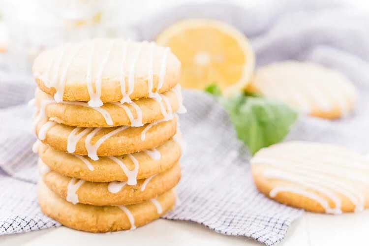 Lemon Basil Shortbread Cookies stacked up with icing.