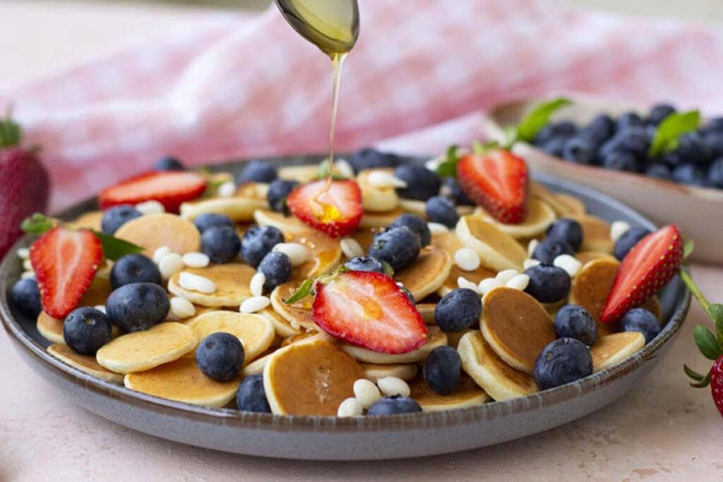 A bowl with mini pancakes.