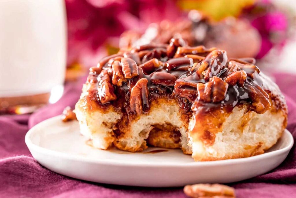 Pecan sticky buns on a plate.