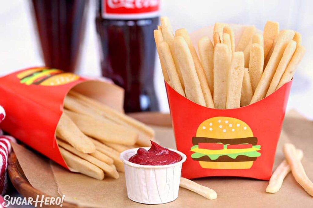 Sugar cookie french fries in a red fry container.