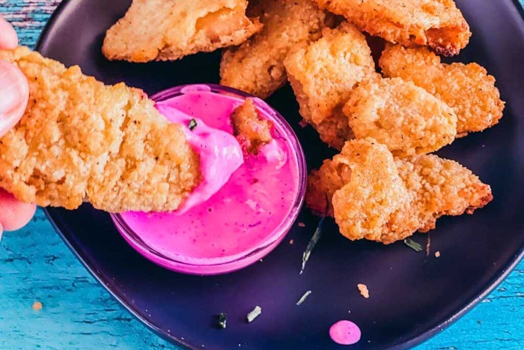 Vegan pink ranch sauce with vegan chicken nuggets