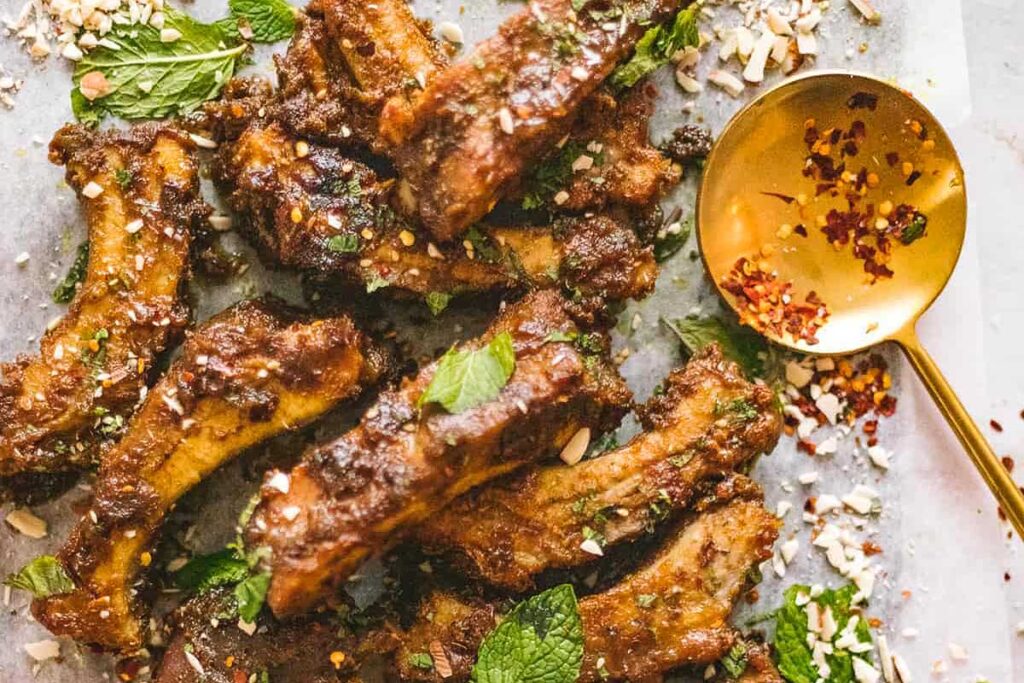 a rack of peanut curry braised ribs, serated.