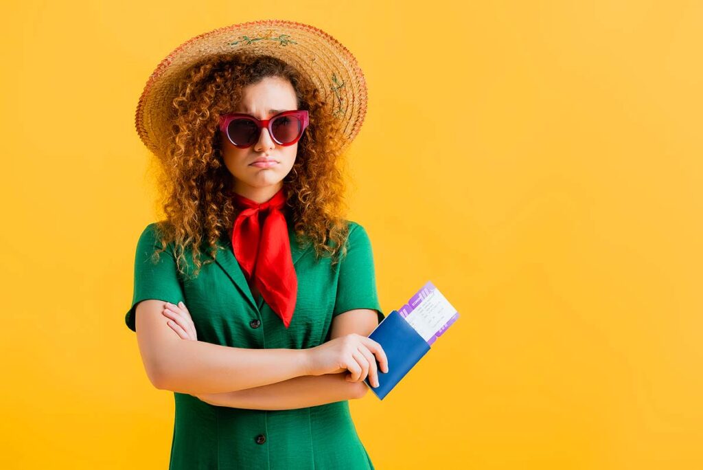Woman with passport looking upset.