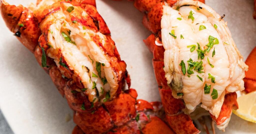 Lobster tails cooked on a platter.