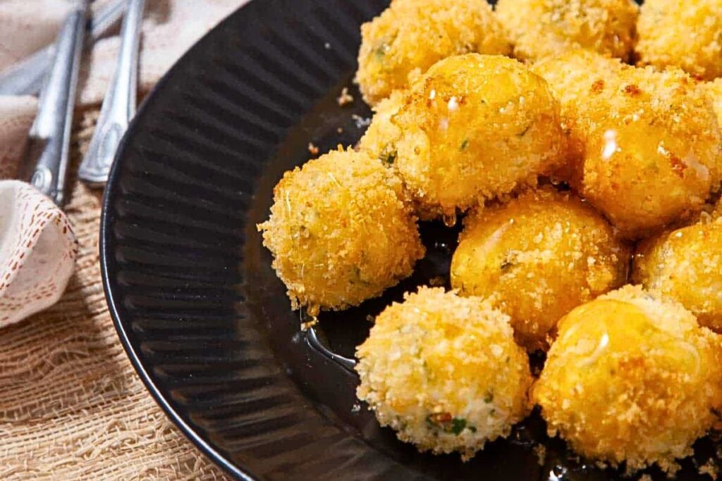 Goat cheese balls on a plate.