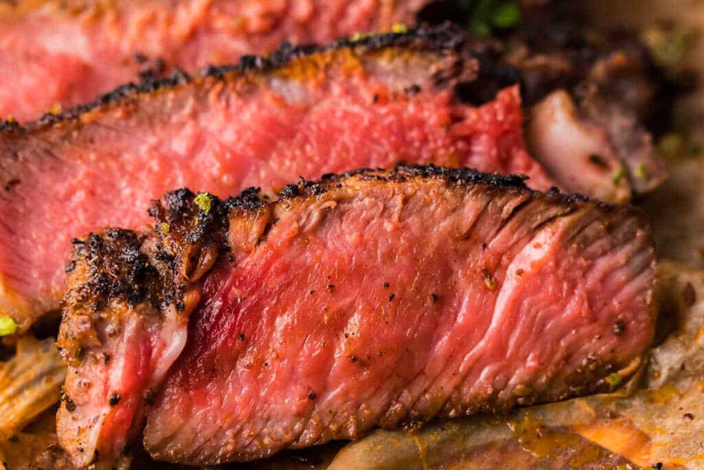 A blackened steak sliced.