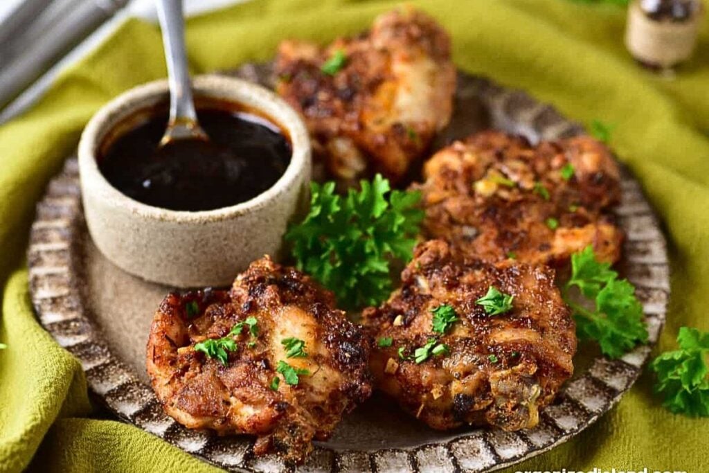 A plate of garlic parmesan chicken thighs.