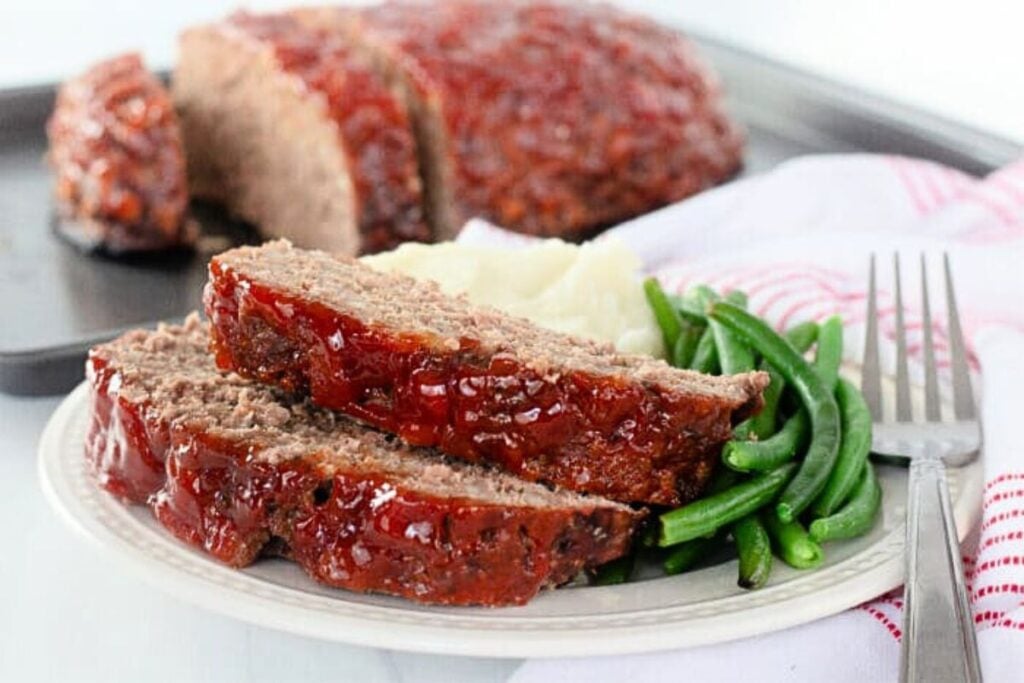 A platter of meatloaf, sliced.