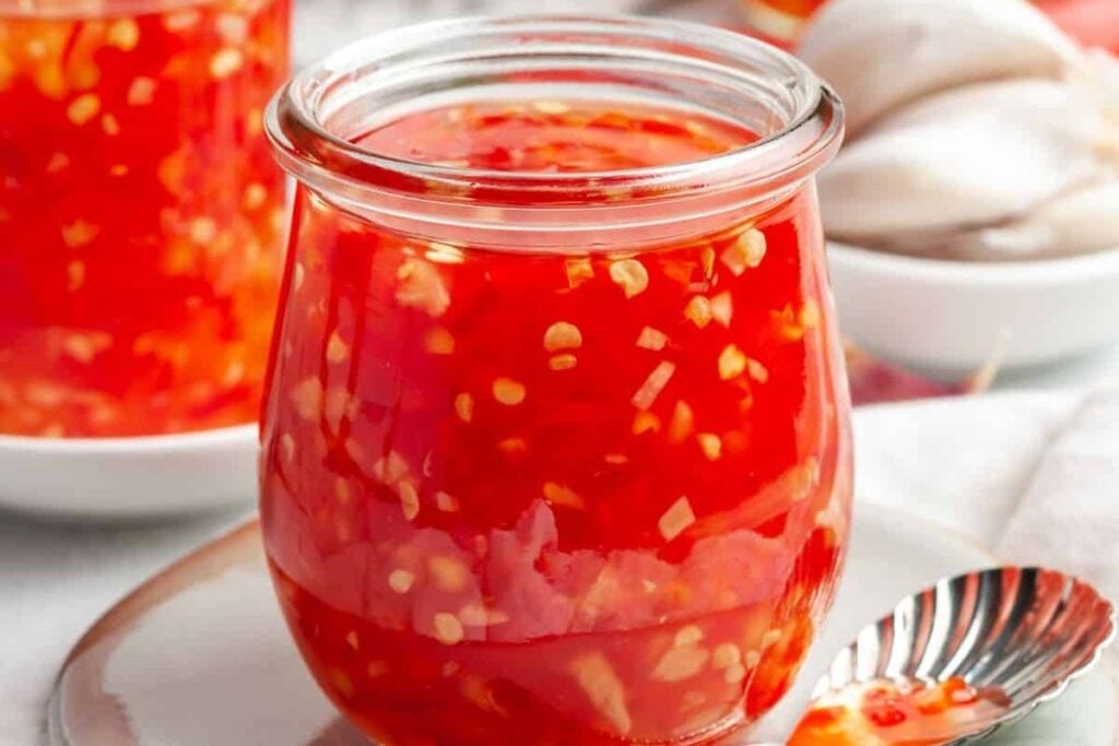 Jars of colorful chili sauce.
