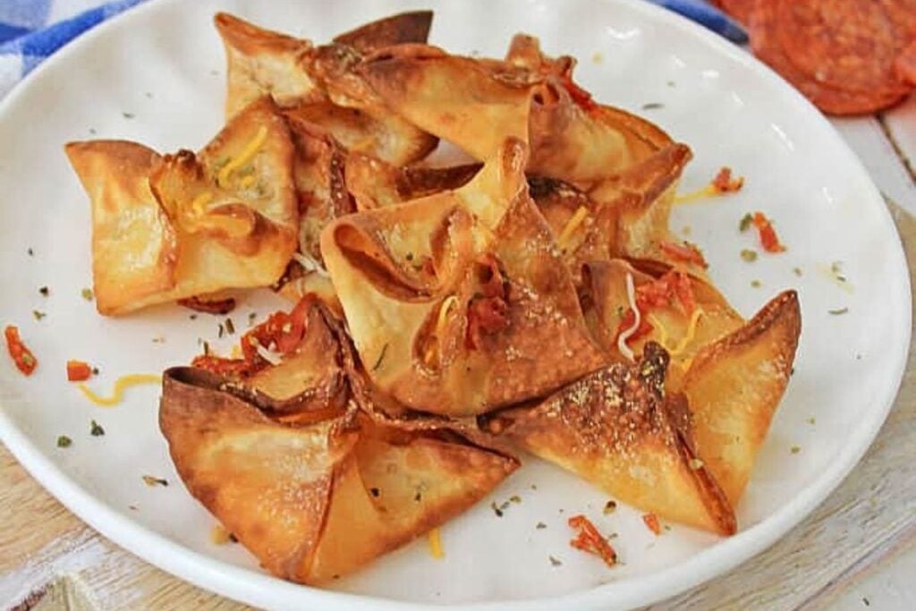 A platter of pizza filled wontons.