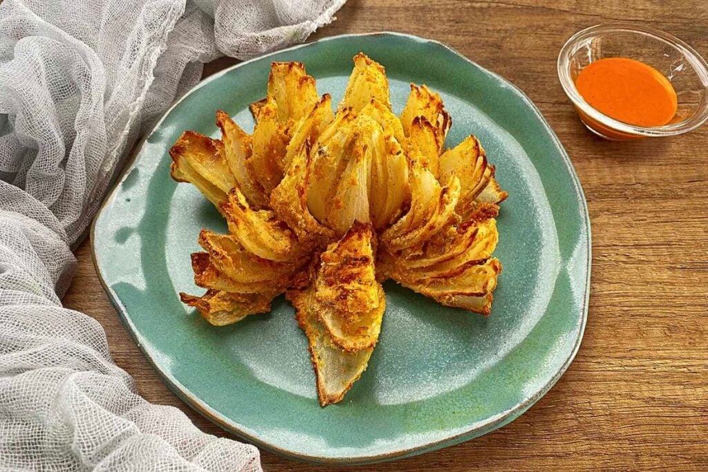 A blooming onion on a plate.