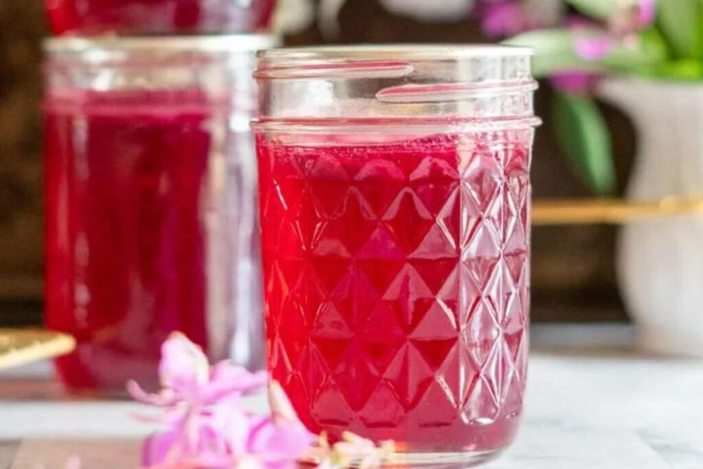Pretty light purple fireweed jelly in jars.