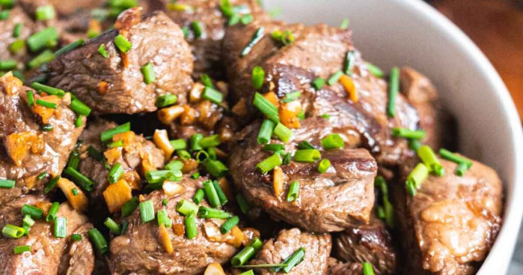 A bowl of garlic butter steak bites.