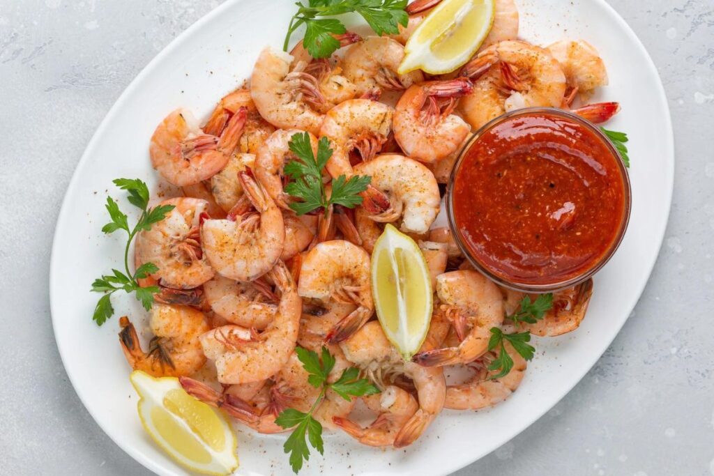 Cocktail sauce with shrimp on a platter
