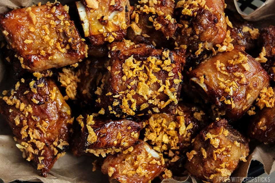A platter of bite sized crispy ribs.