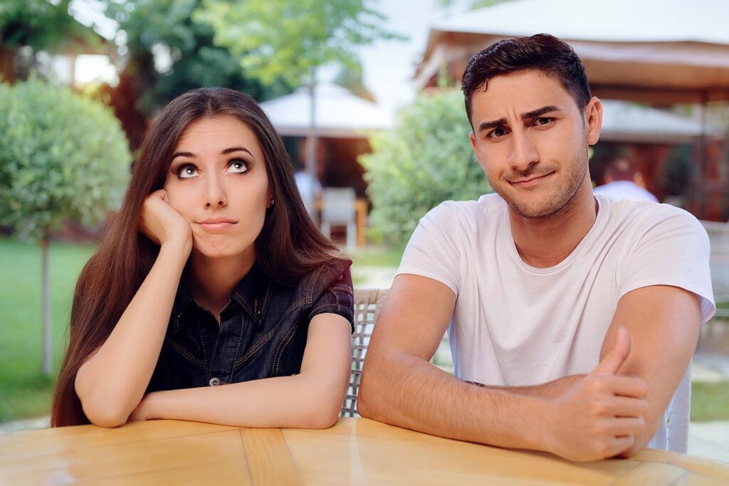 Woman and Man on a Boring Bad Date at the Restaurant.