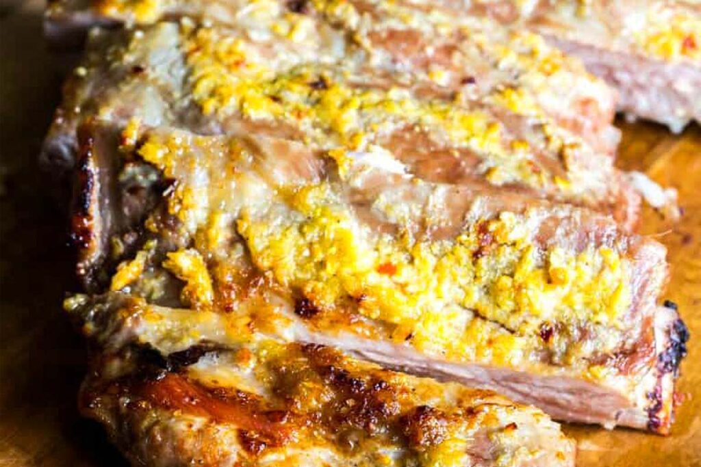 A rack of ribs with seasonings.