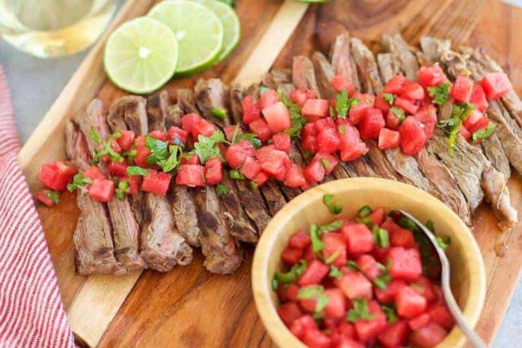 A skirt steak with a salsa topping.