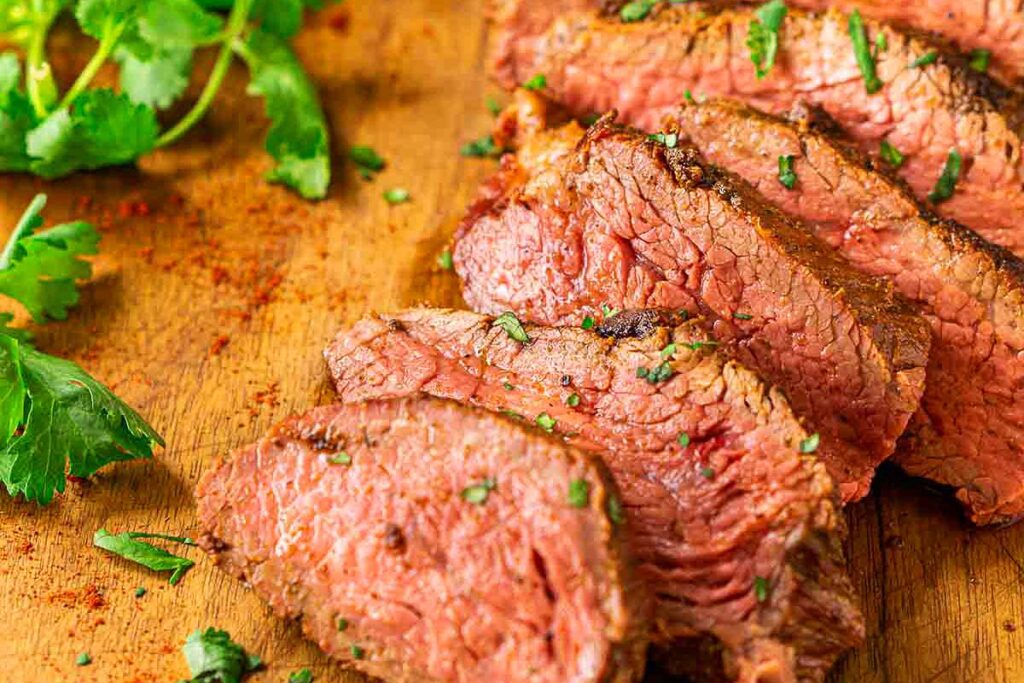 A sliced tri trip steak.