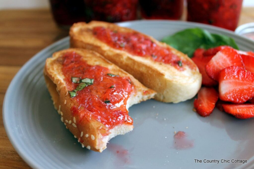Slices of bred spread with strawberry basil jam.