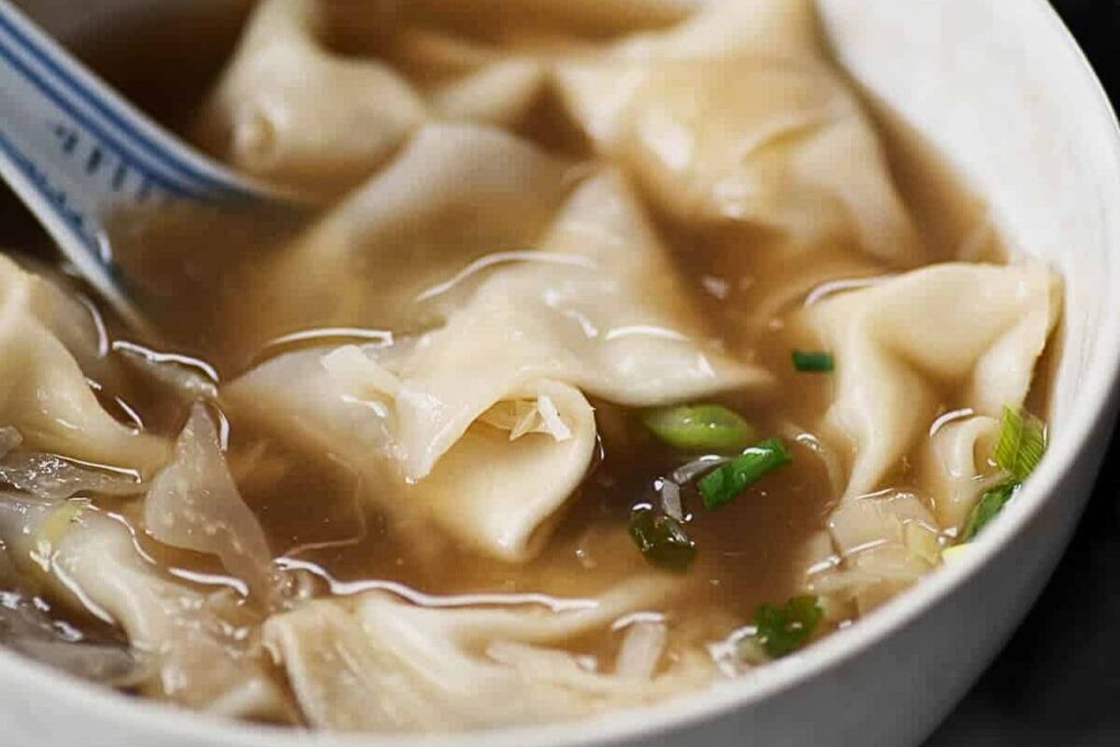 Mushroom wontons in mushroom broth soup.