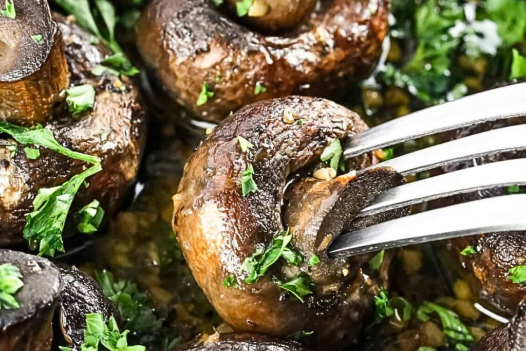 A pan of garlic butter smoked mushrooms.