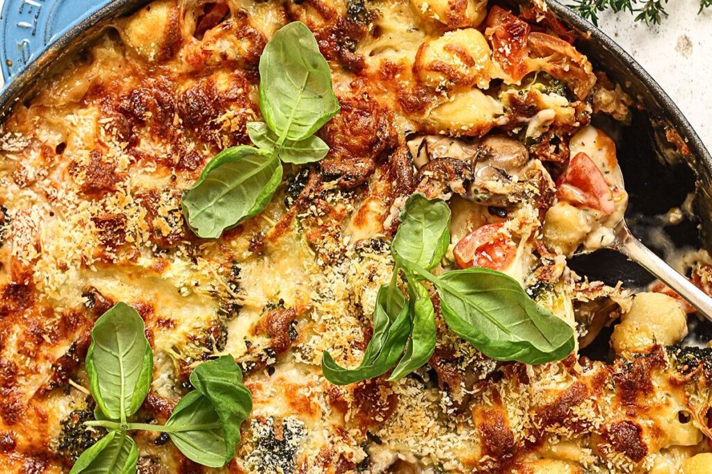 A skillet of cheesy baked gnocchi.