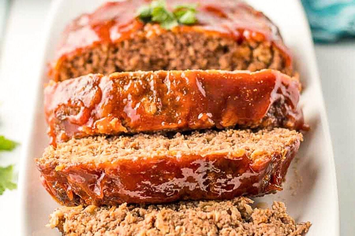 The best ever meatloaf, sliced on a platter.