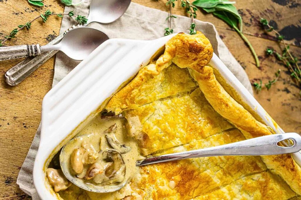 A pot pie filled with chicken and mushrooms.