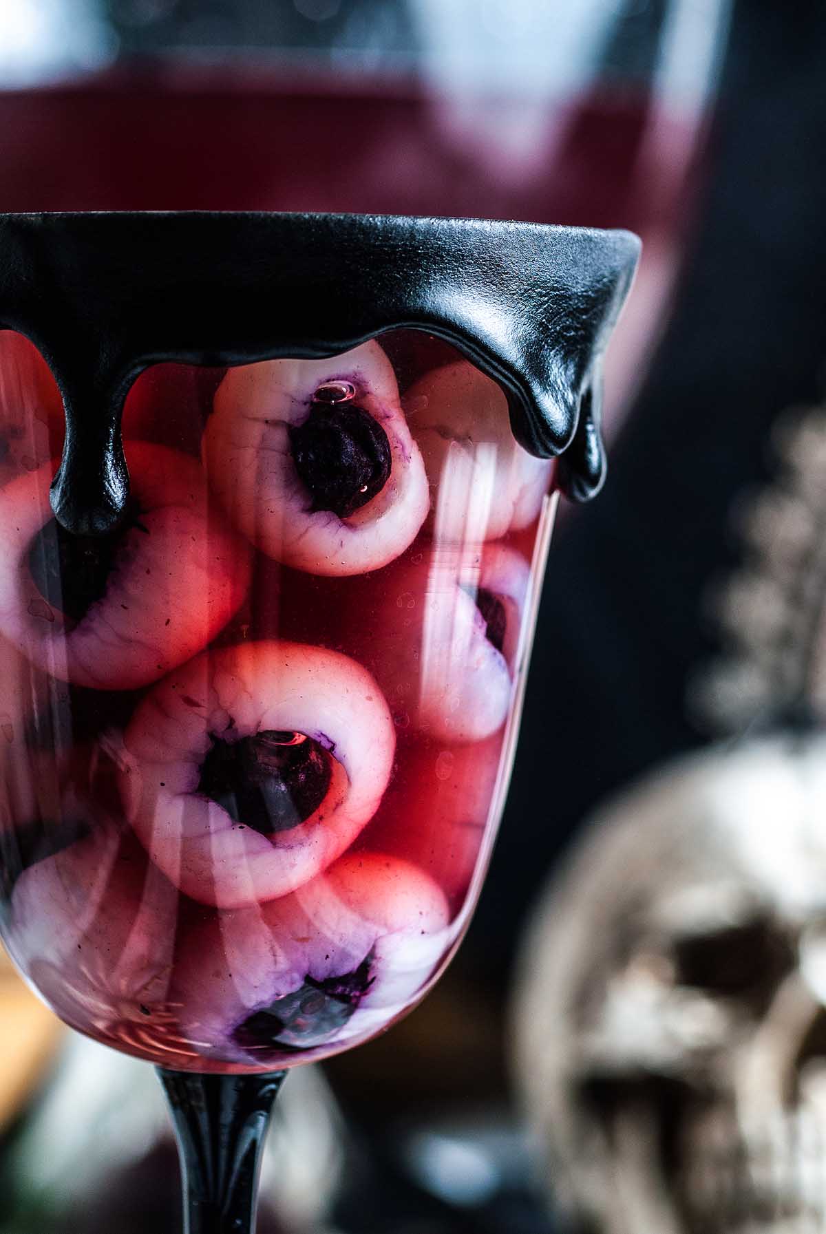 A Halloween punch with eyeballs made from longan fruit and blueberries.