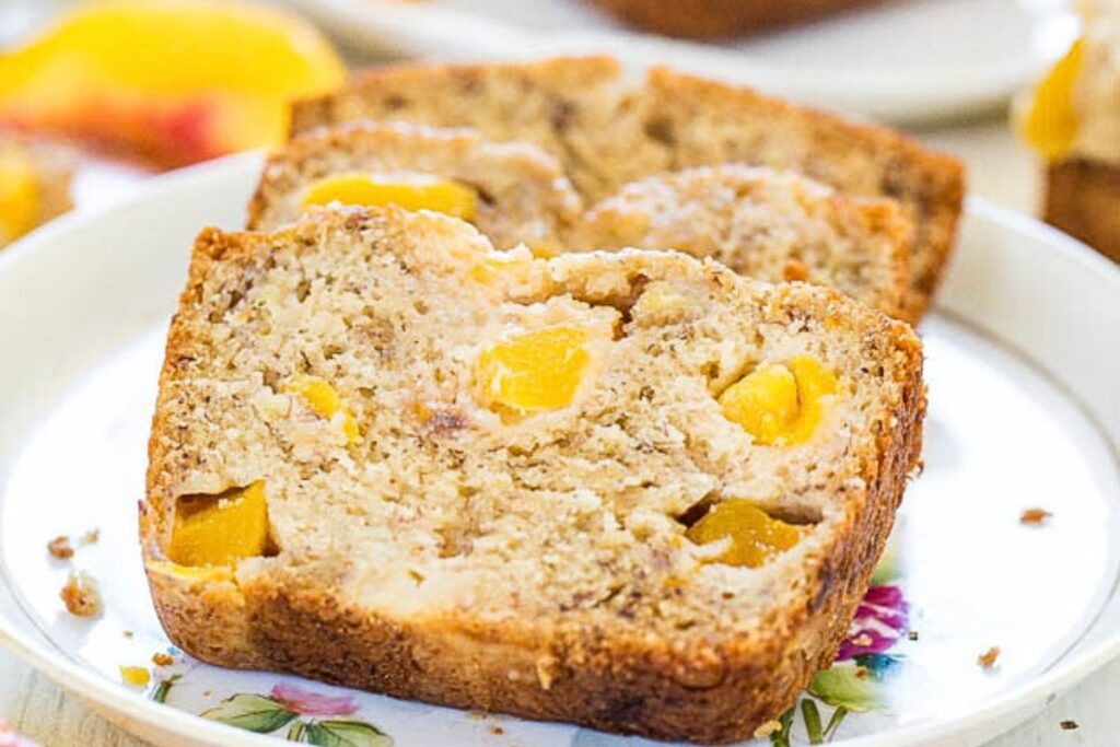 Slices of peach mango banana bread on a plate.