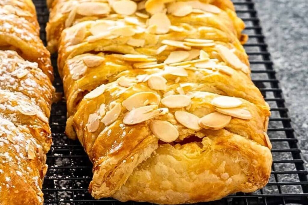 A strudel with peaches and cream filling.