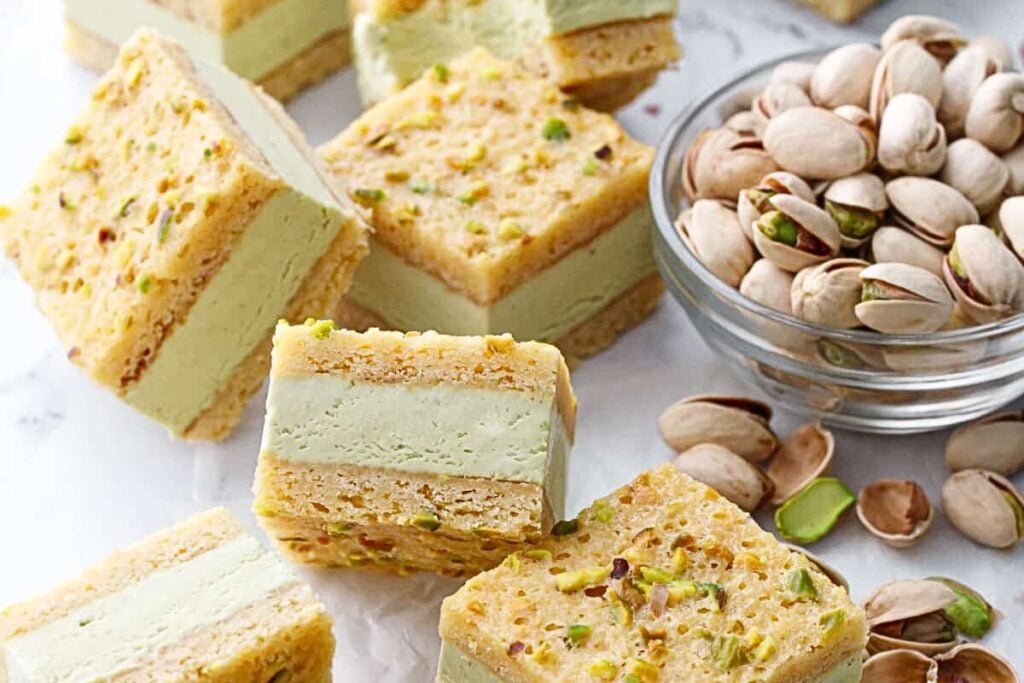 Blondies with pistachios, filled with ice cream for sandwiches.