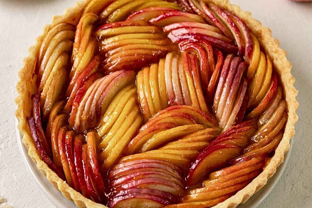 A tart with sliced peaches.
