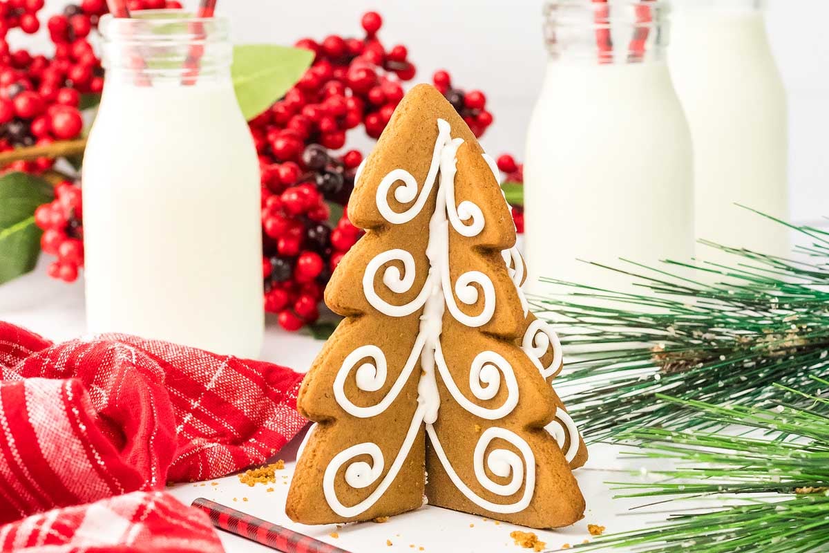 3D gingerbread cookies with milk behind them