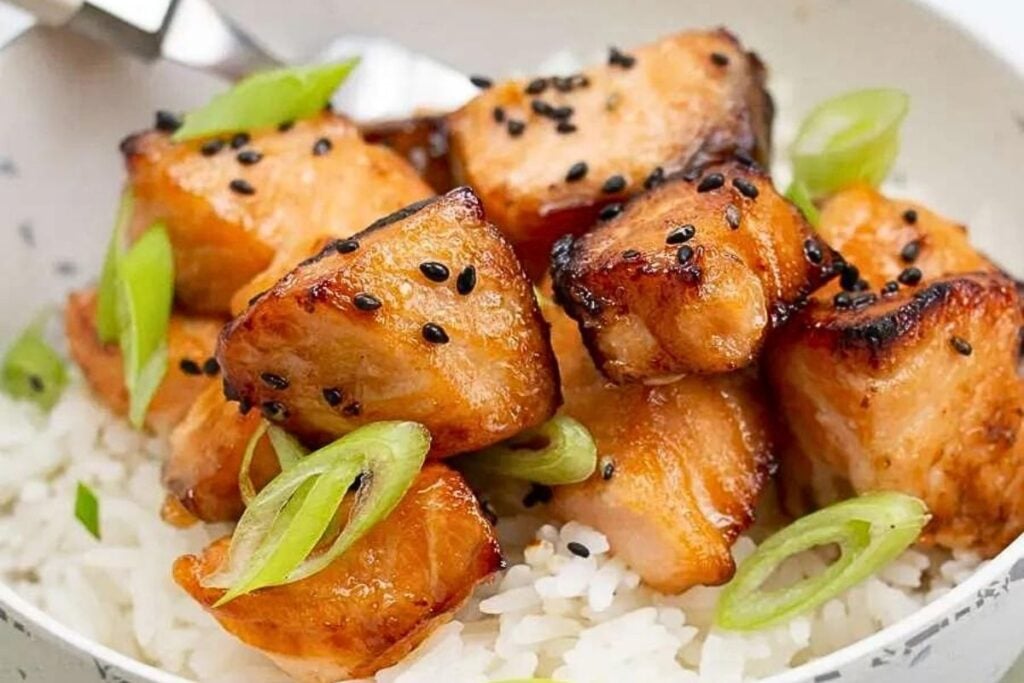 A bowl of air fryer maple salmon over rice.