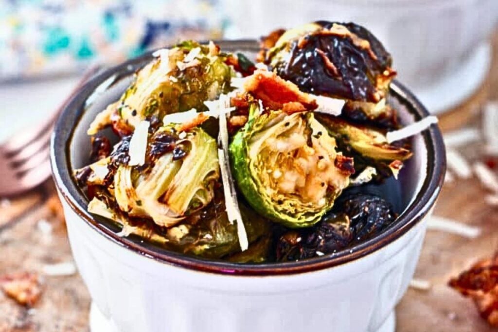 Bowls of roasted brussels sprouts with bacon and parmesan cheese.
