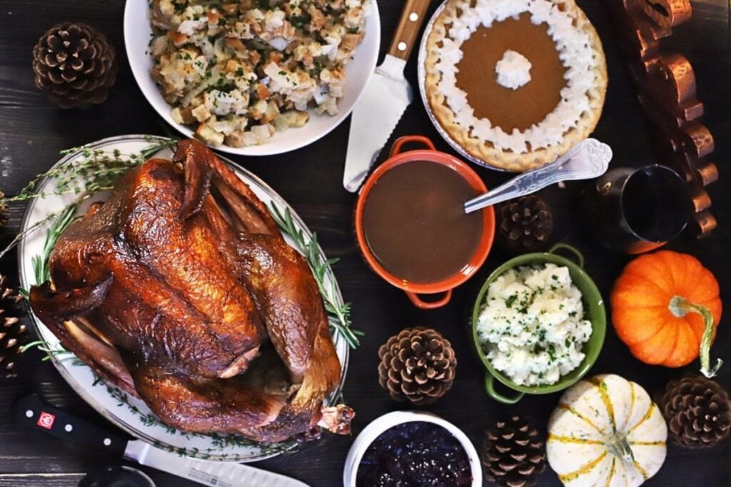 A smoked beer brined turkey on a platter.