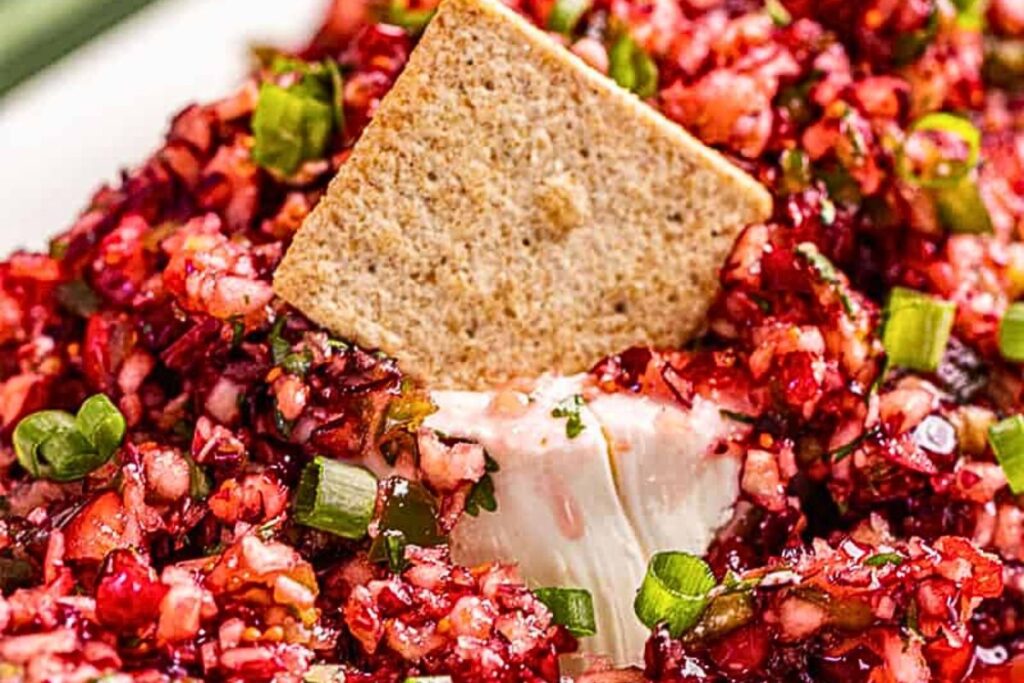 A platter of cranberry salsa over cream cheese.