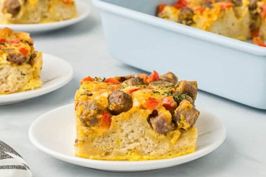 A casserole made of biscuits, eggs and sausage with peppers.
